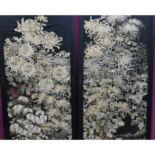 743 - A pair of Chinese black silk panels with allover floral and leaf decoration (some damage to silk), e... 