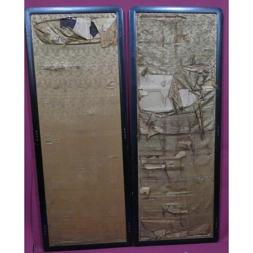 743 - A pair of Chinese black silk panels with allover floral and leaf decoration (some damage to silk), e... 