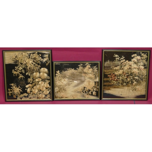 744 - 3 Chinese black silk framed panels depicting garden and floral decoration, in black and gilt frames,... 