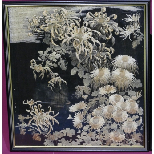 744 - 3 Chinese black silk framed panels depicting garden and floral decoration, in black and gilt frames,... 