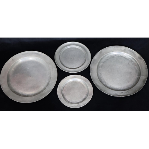 747 - A pair of antique pewter round chargers, 34cm diameter, 2 similar pewter smaller round plates (4)