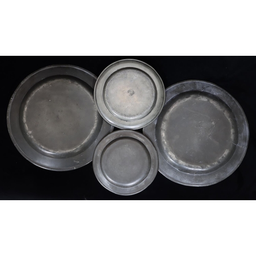 747 - A pair of antique pewter round chargers, 34cm diameter, 2 similar pewter smaller round plates (4)