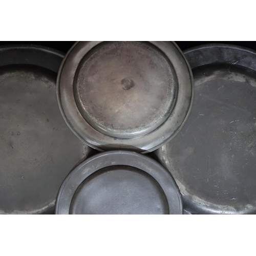 747 - A pair of antique pewter round chargers, 34cm diameter, 2 similar pewter smaller round plates (4)