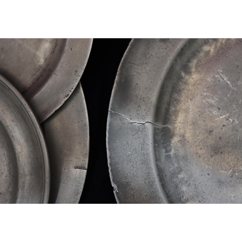 747 - A pair of antique pewter round chargers, 34cm diameter, 2 similar pewter smaller round plates (4)