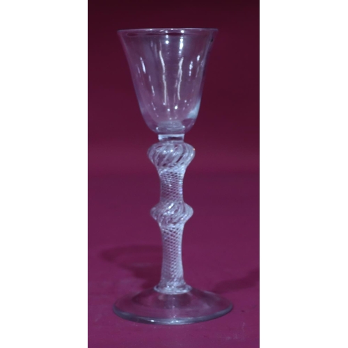 75 - An 18th Century air twist wine glass with collar and central knops, Ogee bowl on conical foot, circa... 