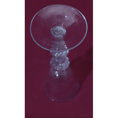 75 - An 18th Century air twist wine glass with collar and central knops, Ogee bowl on conical foot, circa... 