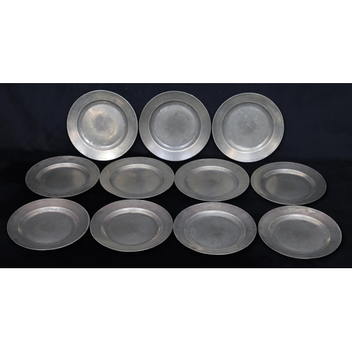 750 - A set of 11 antique pewter round plates, 23.6cm diameter