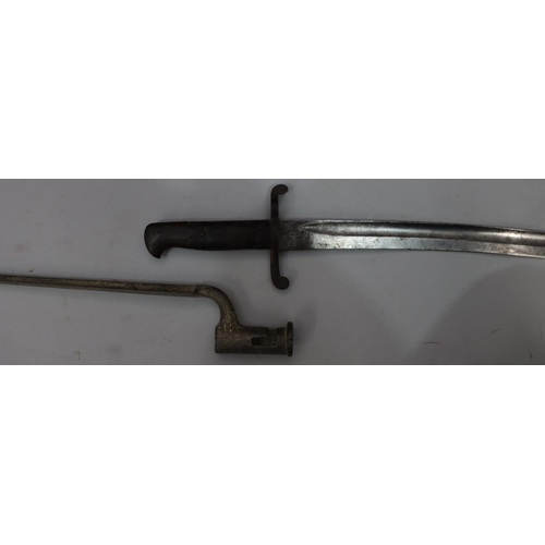 764 - A military bayonet with sheath, stamped S below crown above number 8, 72.5cm long overall, a triangu... 