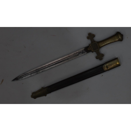 765 - A brass handled dagger with leather and brass sheath, 49.5cm long