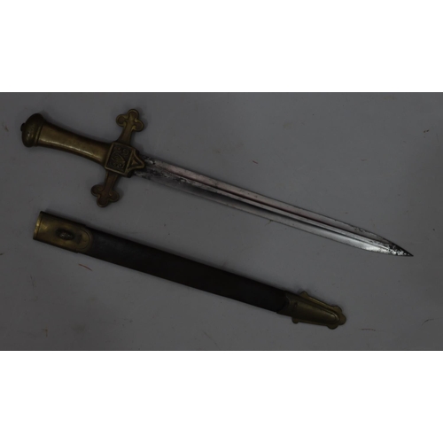 765 - A brass handled dagger with leather and brass sheath, 49.5cm long