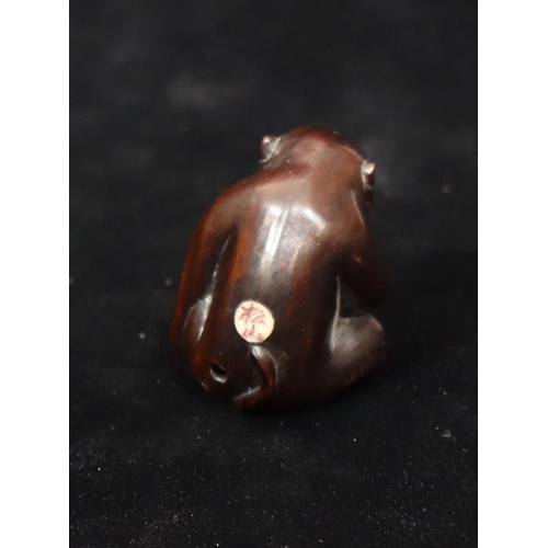 806 - A carved wooden netsuke of a monkey