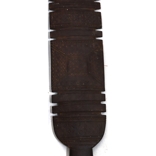 818 - A pair of early carved African wooden clubs with parquetry decoration, 84cm long