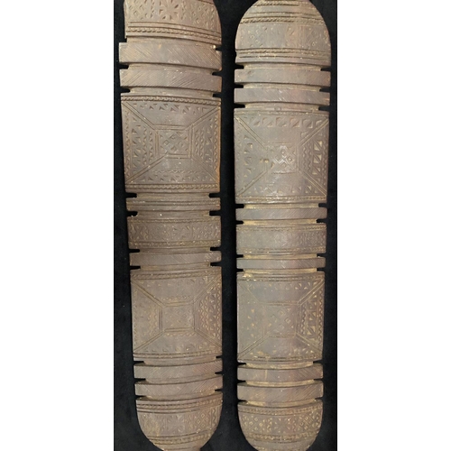 818 - A pair of early carved African wooden clubs with parquetry decoration, 84cm long