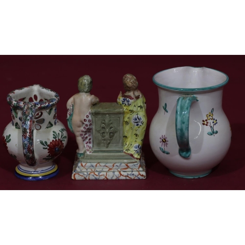 82 - An early 19th Century Staffordshire Pratt Ware style group of 2 figures standing next to plinth, 13.... 