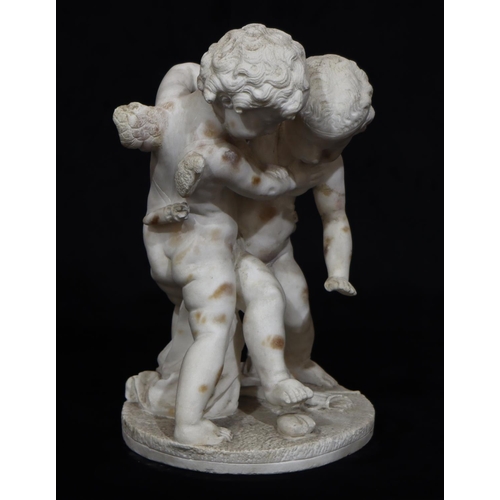 820 - A white marble group of 2 cupids on round base (wings to 1 a/f), 43cm high