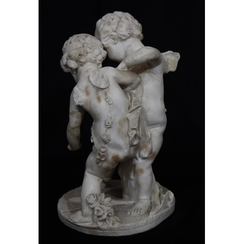 820 - A white marble group of 2 cupids on round base (wings to 1 a/f), 43cm high