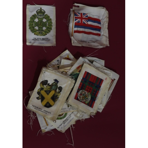 823 - A quantity of various silk and other cigarette cards including military crests, John Players, Footba... 