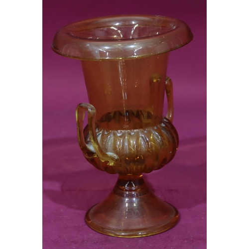83 - A 16th Century amber glass round bulbous 2-handled trumpet shaped Pania vase on sweeping base, 25cm ... 