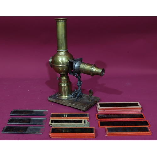 837 - A brass Magic Lantern with a quantity of various glass slides 