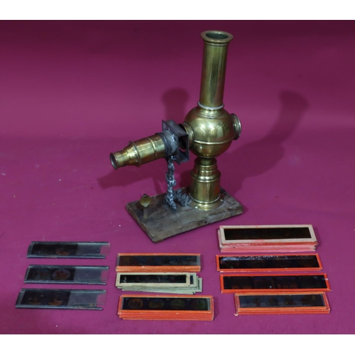 837 - A brass Magic Lantern with a quantity of various glass slides 