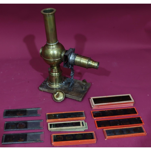 837 - A brass Magic Lantern with a quantity of various glass slides 