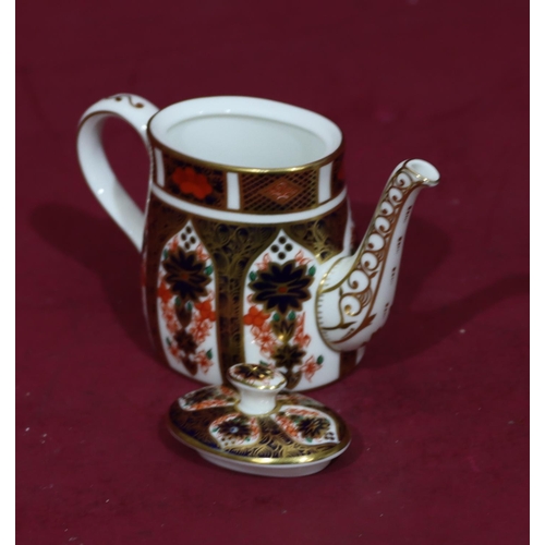 84 - A modern Royal Crown Derby miniature oval Imari pattern teapot, 7.5cm