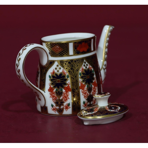 84 - A modern Royal Crown Derby miniature oval Imari pattern teapot, 7.5cm