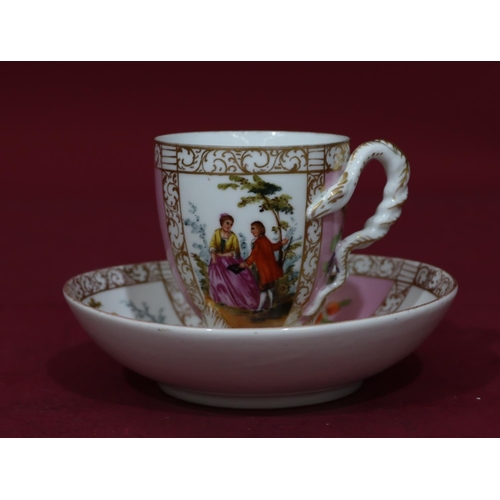 90 - A Dresden cup and saucer on white and pink ground with multicoloured figure, floral, leaf and gilt d... 