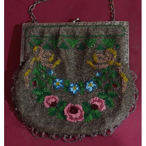 908 - A ladies' plated evening bag with multicoloured bead work with floral, ribbon and leaf decoration, w... 