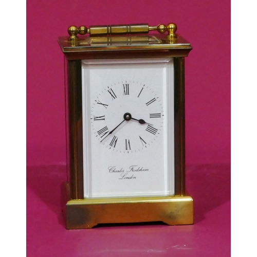 913 - Charles Frodsham, London, brass carriage clock with white enamel dial and Roman numerals, swing over... 