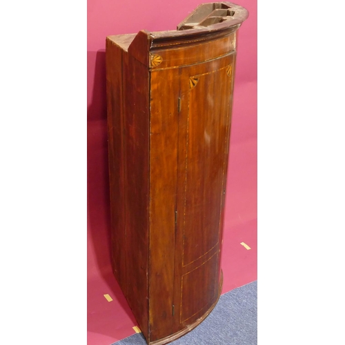 927 - A George III mahogany small bow fronted hanging corner cupboard with inlaid star motifs, 2 panel doo... 