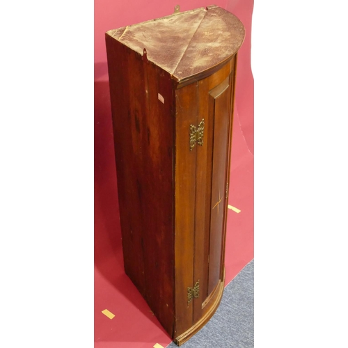 928 - A George III mahogany bow fronted hanging corner cupboard with allover marquetry, shell and banding ... 