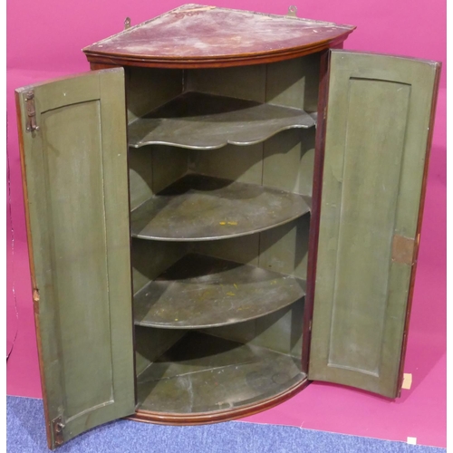 928 - A George III mahogany bow fronted hanging corner cupboard with allover marquetry, shell and banding ... 