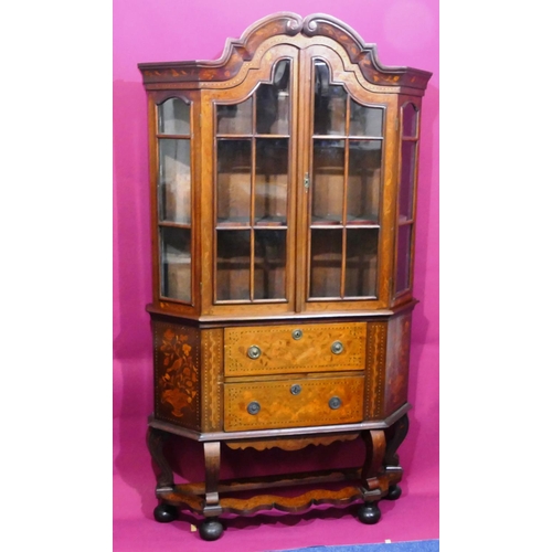 932 - A 19th Century Continental marquetry bookcase with scallop shaped scroll top, allover bird, basket, ... 