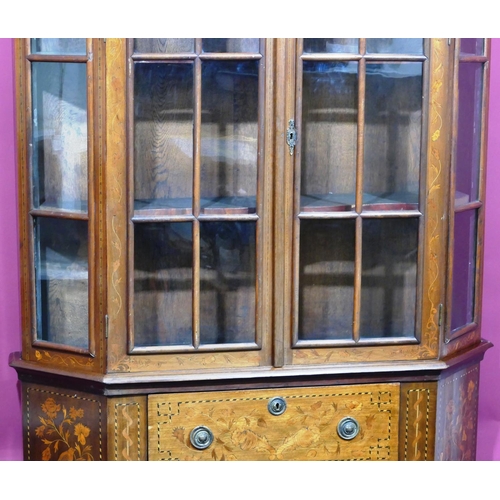 932 - A 19th Century Continental marquetry bookcase with scallop shaped scroll top, allover bird, basket, ... 