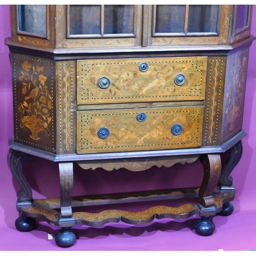 932 - A 19th Century Continental marquetry bookcase with scallop shaped scroll top, allover bird, basket, ... 