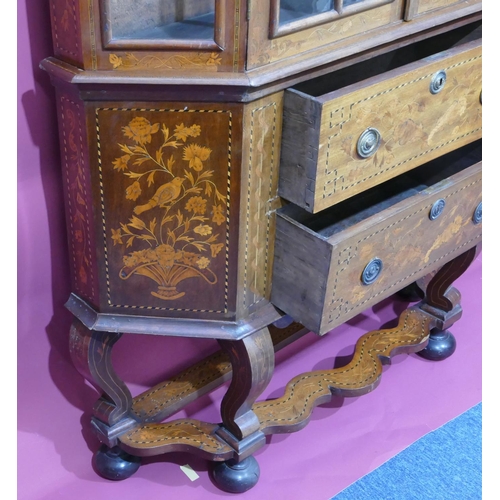 932 - A 19th Century Continental marquetry bookcase with scallop shaped scroll top, allover bird, basket, ... 