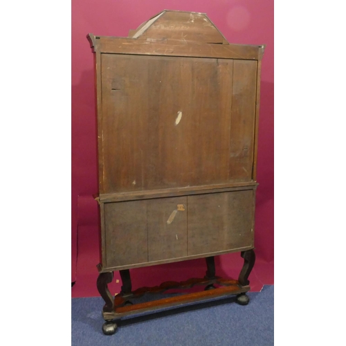 932 - A 19th Century Continental marquetry bookcase with scallop shaped scroll top, allover bird, basket, ... 