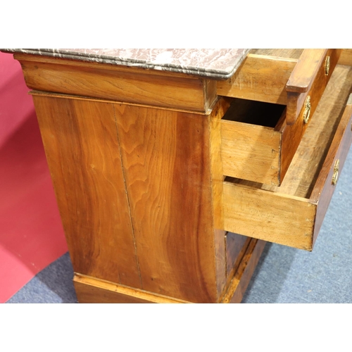 935 - A Continental walnut straight front commode with black marble top, 4 long drawers below with drop br... 