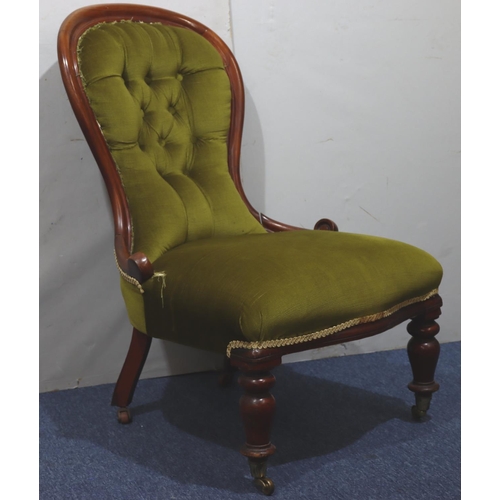 940 - A 19th Century mahogany spoon back nursing chair with green velvet overstuffed seat and button back ... 