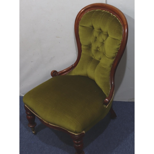 940 - A 19th Century mahogany spoon back nursing chair with green velvet overstuffed seat and button back ... 