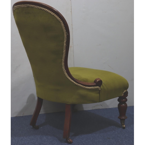 940 - A 19th Century mahogany spoon back nursing chair with green velvet overstuffed seat and button back ... 