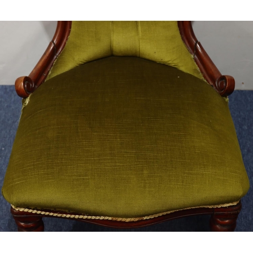 940 - A 19th Century mahogany spoon back nursing chair with green velvet overstuffed seat and button back ... 