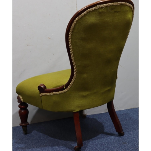 940 - A 19th Century mahogany spoon back nursing chair with green velvet overstuffed seat and button back ... 