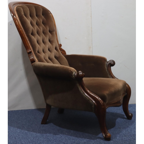 941 - A 19th Century mahogany spoon back armchair with brown velvet overstuffed seat, button back and padd... 