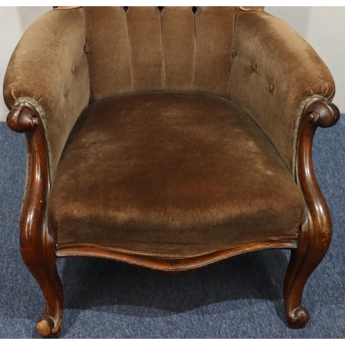 941 - A 19th Century mahogany spoon back armchair with brown velvet overstuffed seat, button back and padd... 