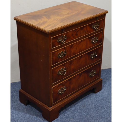 945 - A reproduction mahogany small straight front chest of drawers, brush slide above 4 long graduated dr... 