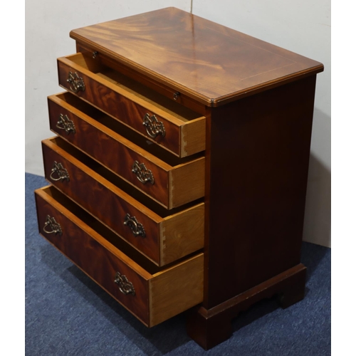 945 - A reproduction mahogany small straight front chest of drawers, brush slide above 4 long graduated dr... 