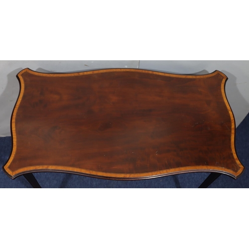 946 - An Edwardian mahogany rectangular scallop shaped occasional table with inlaid banding on square reed... 