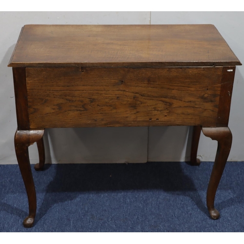 947 - An oak lowboy with long drawer above kneehole and 2 short drawers with drop brass handles on cabriol... 